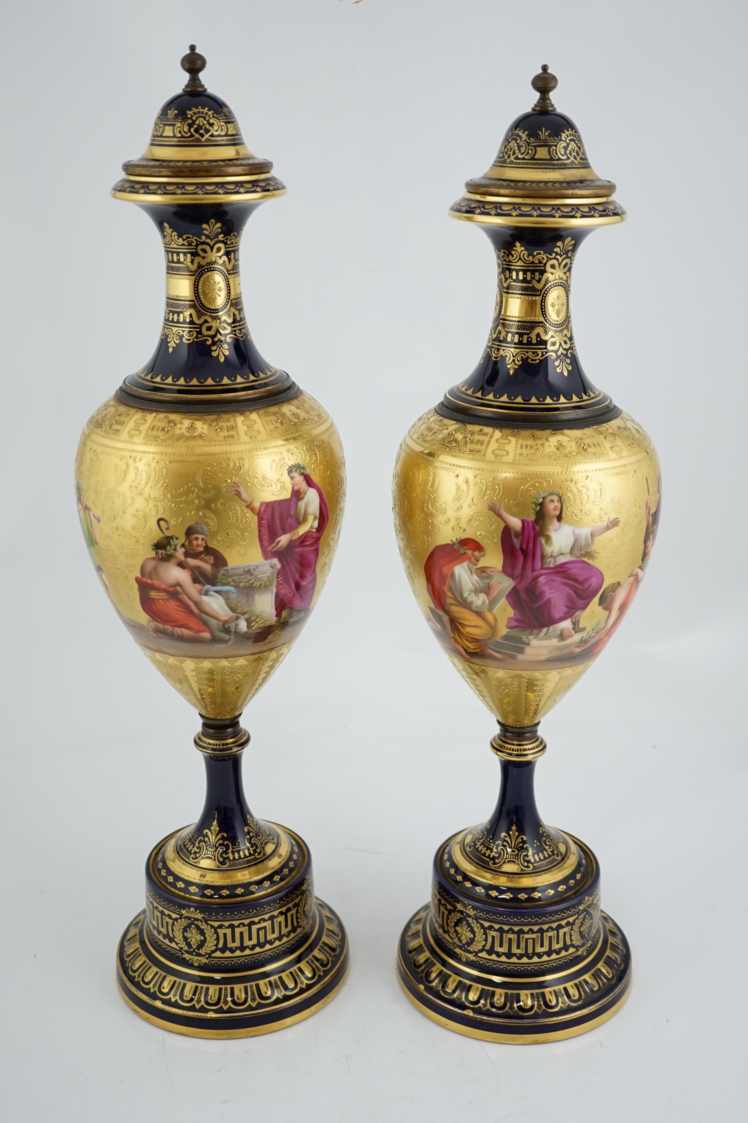 A pair of tall Vienna style porcelain vases and covers, early 20th century